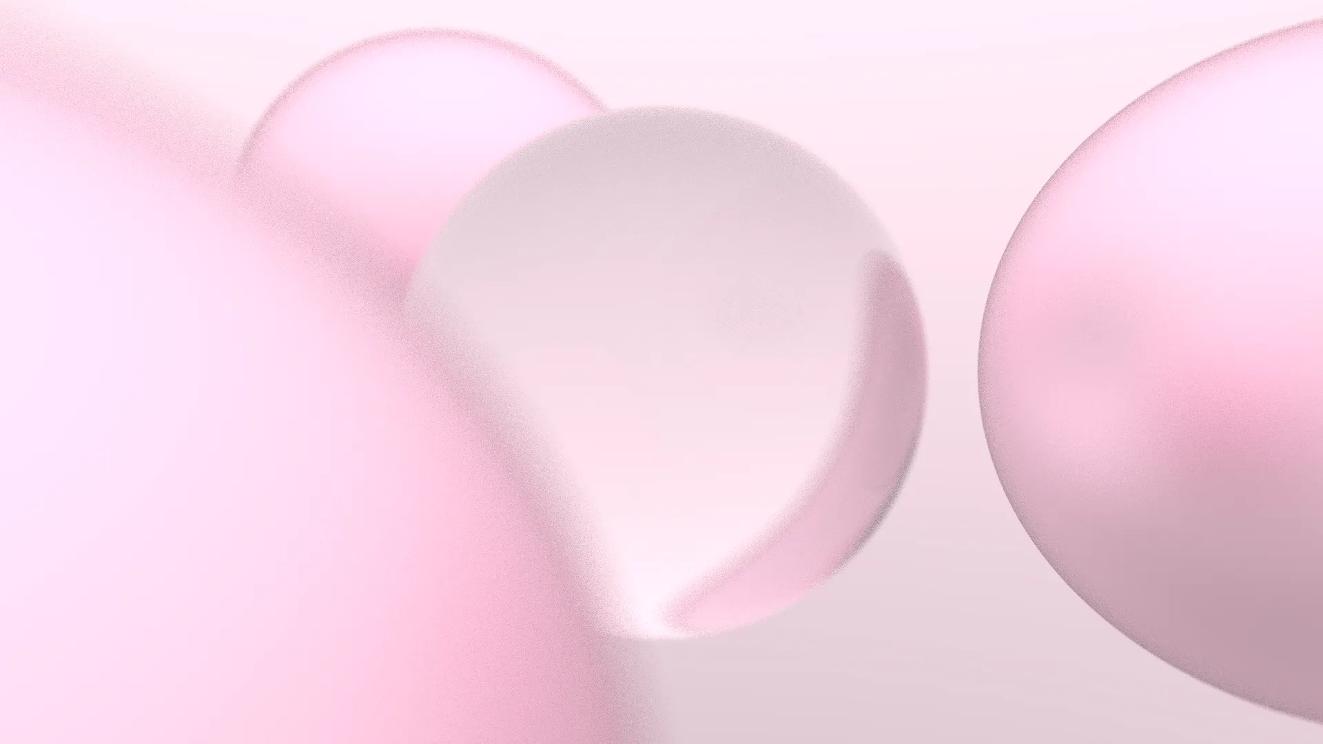 Pink and glass spheres are in and out of focus.