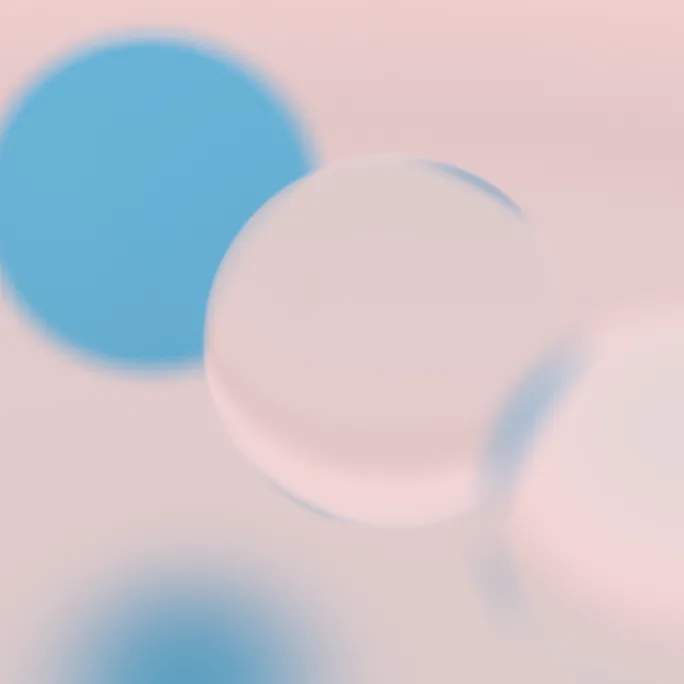 A few spheres of different materials are in and out of focus.